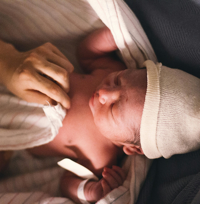 Newborn baby wrapped in a blanket, symbolizing the arrival of Generation Beta.