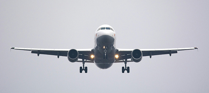 Stock photo of an airplane flying.