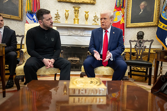 Two men in a formal meeting in a richly decorated room, discussing NATO and Ukraine-related issues.