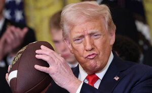 “Keep Them Down”: Trump Pulls Absurd Stunt To Look Taller Than Towering Ohio State Football Team