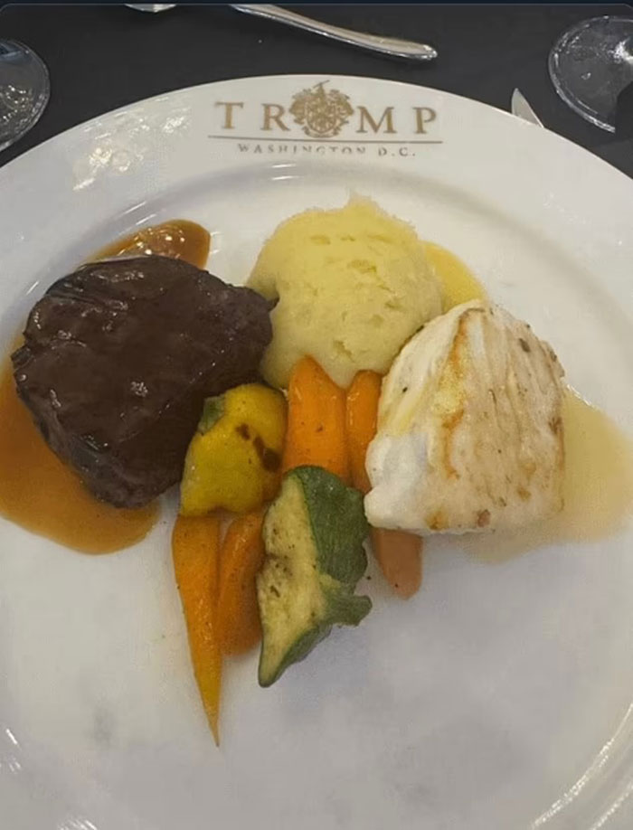 Steak, fish, mashed potatoes, and vegetables served on a Trump Washington D.C. event plate at a crypto dinner.