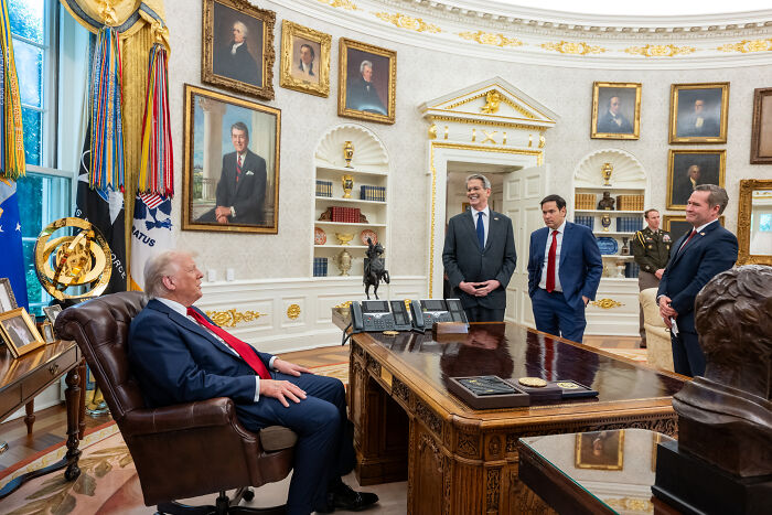 Mike Waltz meeting officials in the Oval Office after being ousted from post amid Signal group chat scandal.