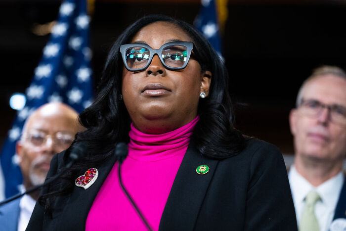 House Democrat speaking at a press event after ICE facility visit, with GOP warning potential for more arrests ahead.
