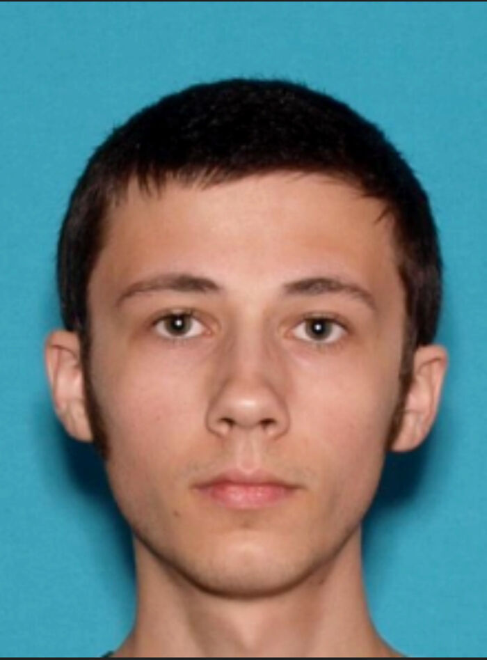 Young man with short dark hair and neutral expression, associated with IVF clinic bomber and pro-moralist views.