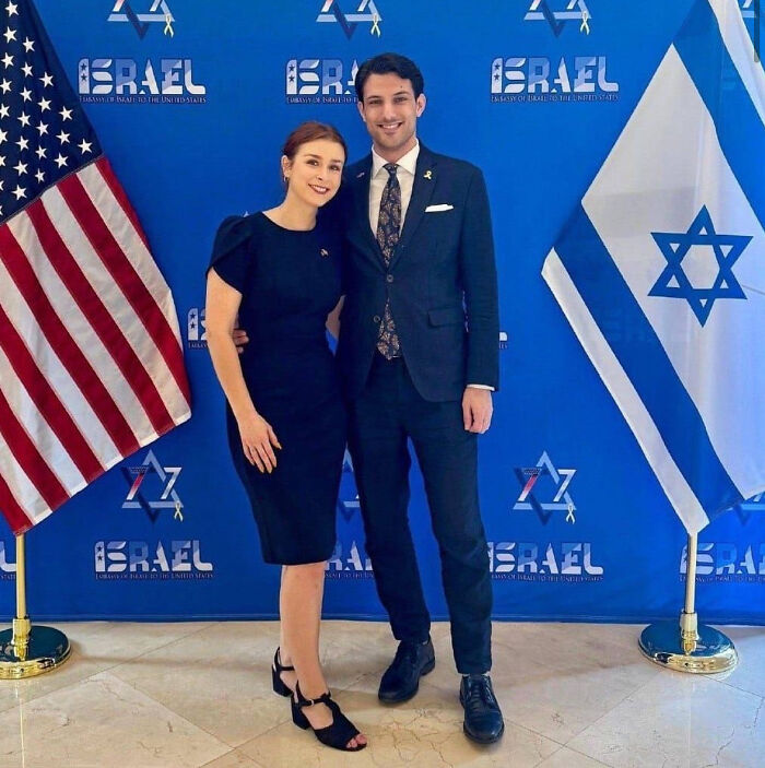 Couple posing in front of Israeli and American flags at the Israeli Embassy, connected to fatal shooting at Jewish Museum.
