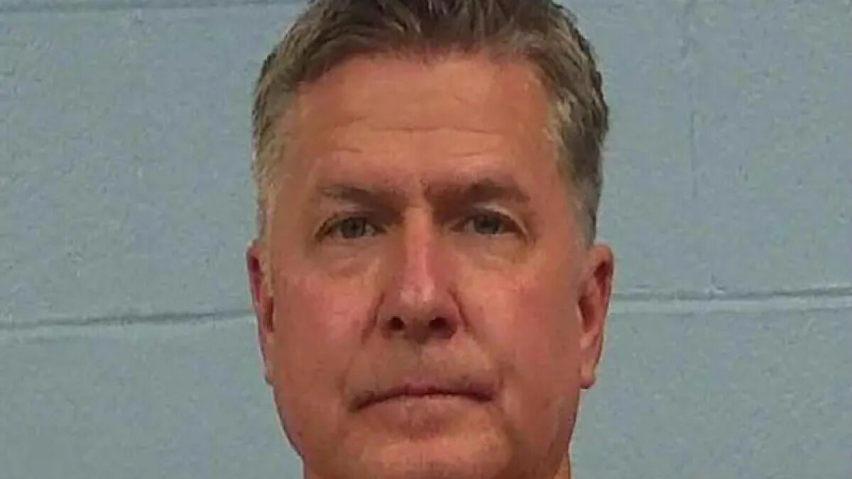 Mugshot of a middle-aged man accused as a divorce lawyer in a clientu2019s cold-case murder investigation by police.