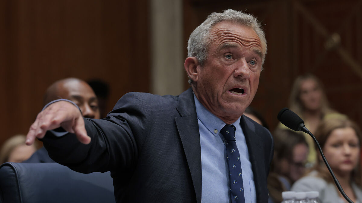 RFK Jr. speaking passionately during a hearing, emphasizing Americans should not take medical advice from him.