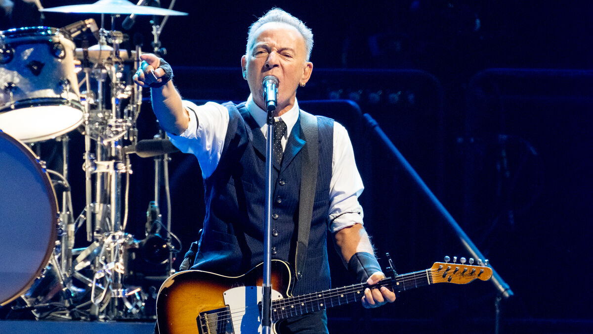 Bruce Springsteen performing passionately onstage, delivering a scathing message about Trump during a live concert.