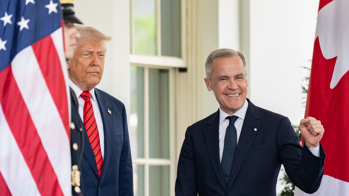 Former President Trump and a Canadian official near U.S. and Canada flags discussing a bold defense deal proposal.