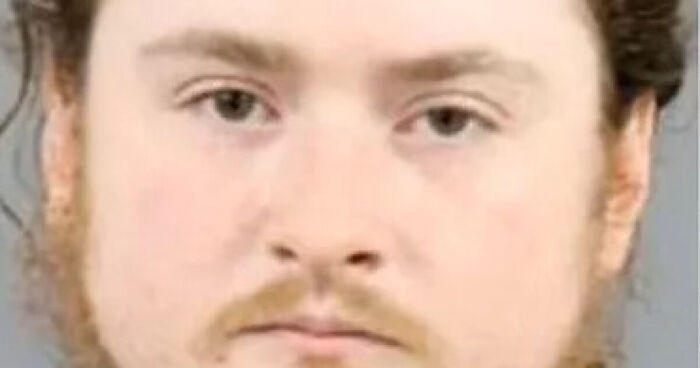 Close-up of a man with curly hair and beard, associated with the baby found in a disgusting home with rotting goat carcass and animals.