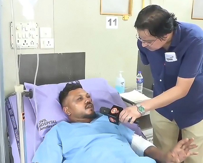 Lone survivor of Air India crash lying in hospital bed, being interviewed about the flight’s final moments.