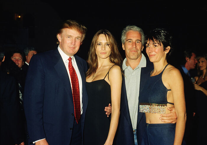 Donald Trump and Jeffrey Epstein posing with two women at a formal event, linked to Epstein files controversy.