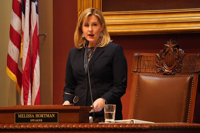 Melissa Hortman speaking at the podium in the legislative chamber during a session on lawmakers’ attack investigation.