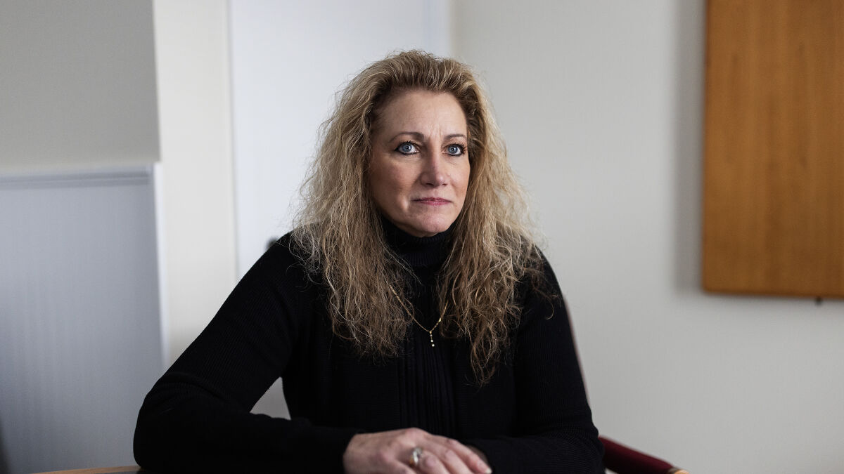 Woman in black sweater sitting at desk portraying reverse discrimination claim in Ohio legal case discussed by Supreme Court