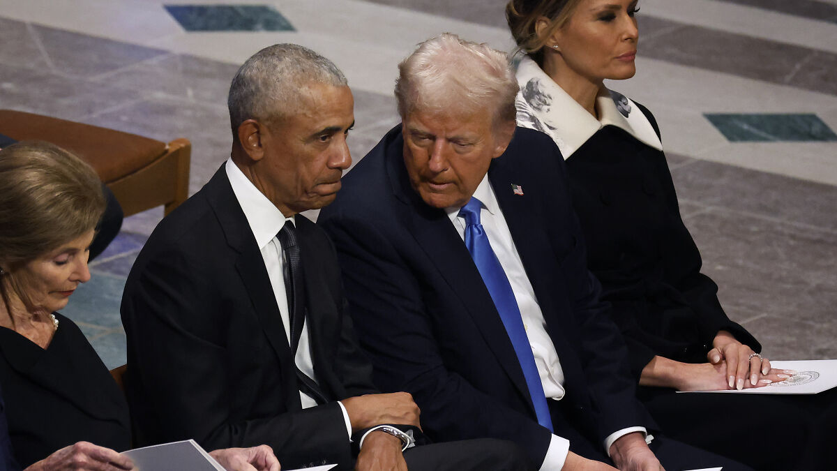 Barack Obama and Donald Trump seated closely, engaged in conversation at a formal event, highlighting political shift.