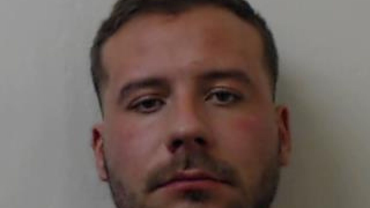 Close-up of man with short hair and beard, related to case where man accessed porn frequently while covering up girlfriend's murder.