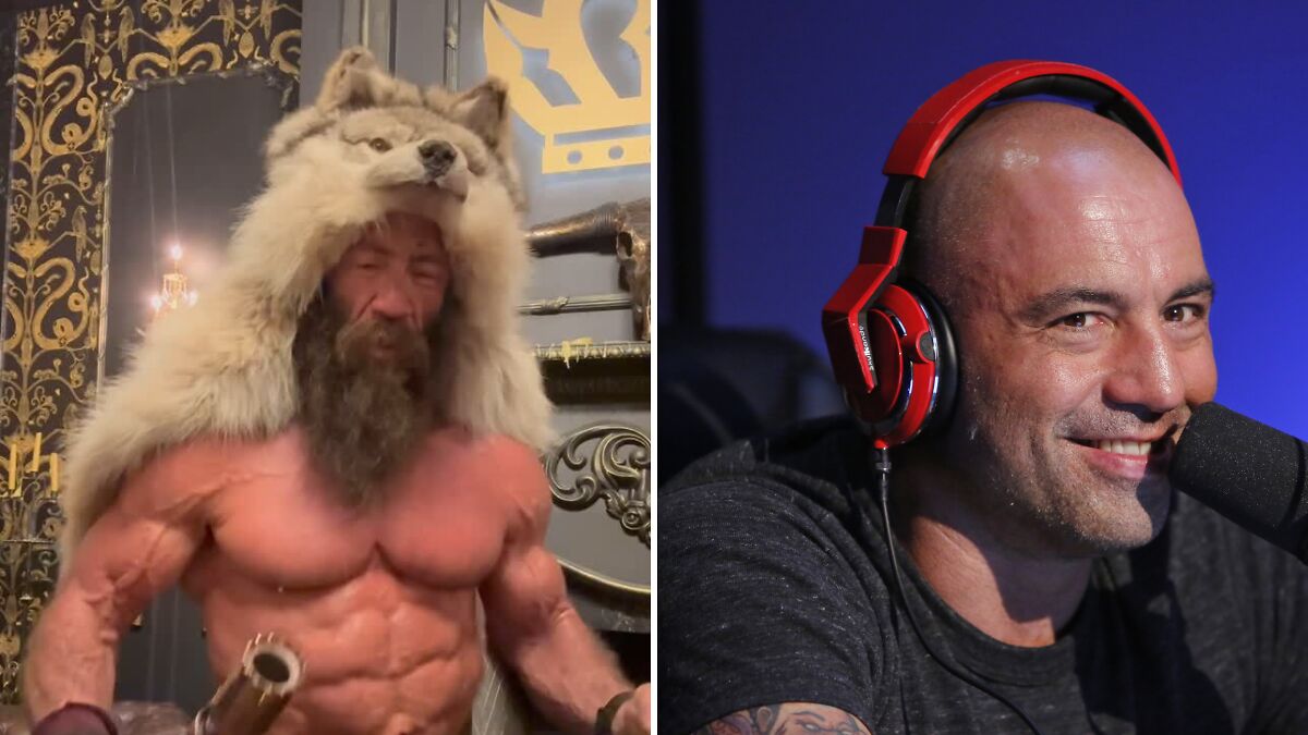 Muscular Liver King wearing a wolf headdress and Joe Rogan speaking into a microphone with headphones in a studio.