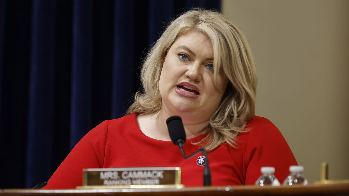 Florida GOP representative speaking at a hearing, discussing abortion law and emergency care delays in a formal setting.