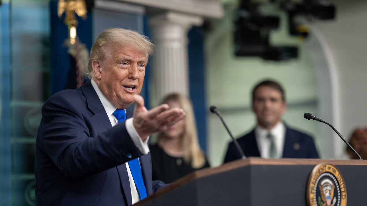 Former President Trump speaking at a podium during a Senate vote-a-rama on a big beautiful bill session.
