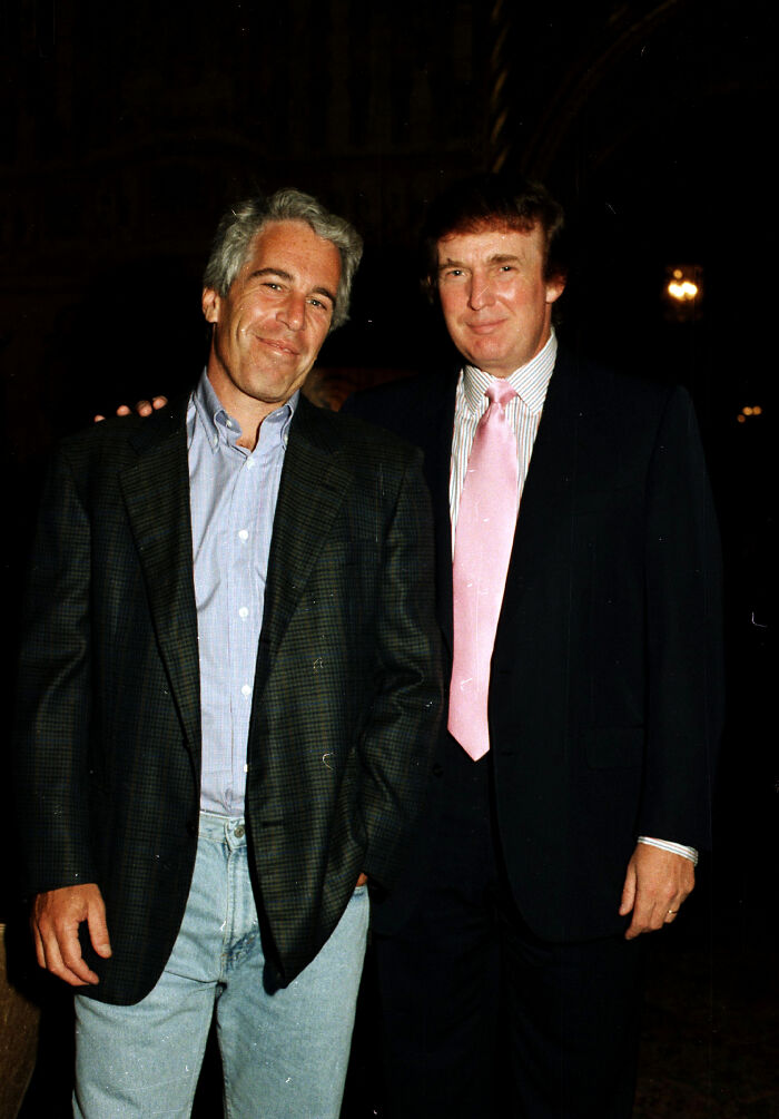 Donald Trump and Jeffrey Epstein posing together at an event, related to Trump slamming reporter about Epstein questions.