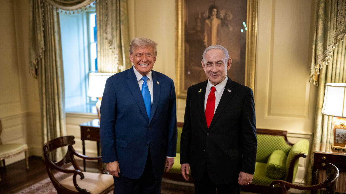 Donald Trump and Benjamin Netanyahu standing in a formal room, related to peace prize nomination after Iran conflict.