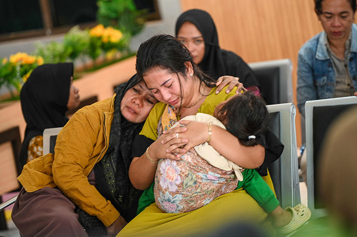 Relatives mourn as dozens go missing after ferry carrying 65 passengers sinks near Indonesia’s Bali in a waiting area.